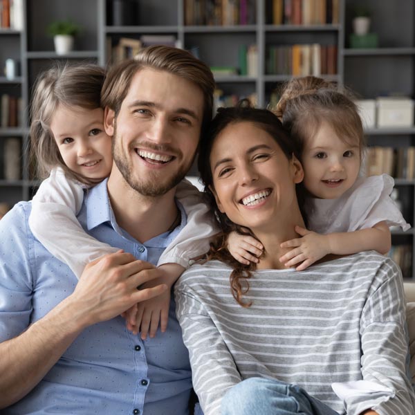smiling family of four